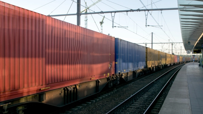 Freight train passing through a station