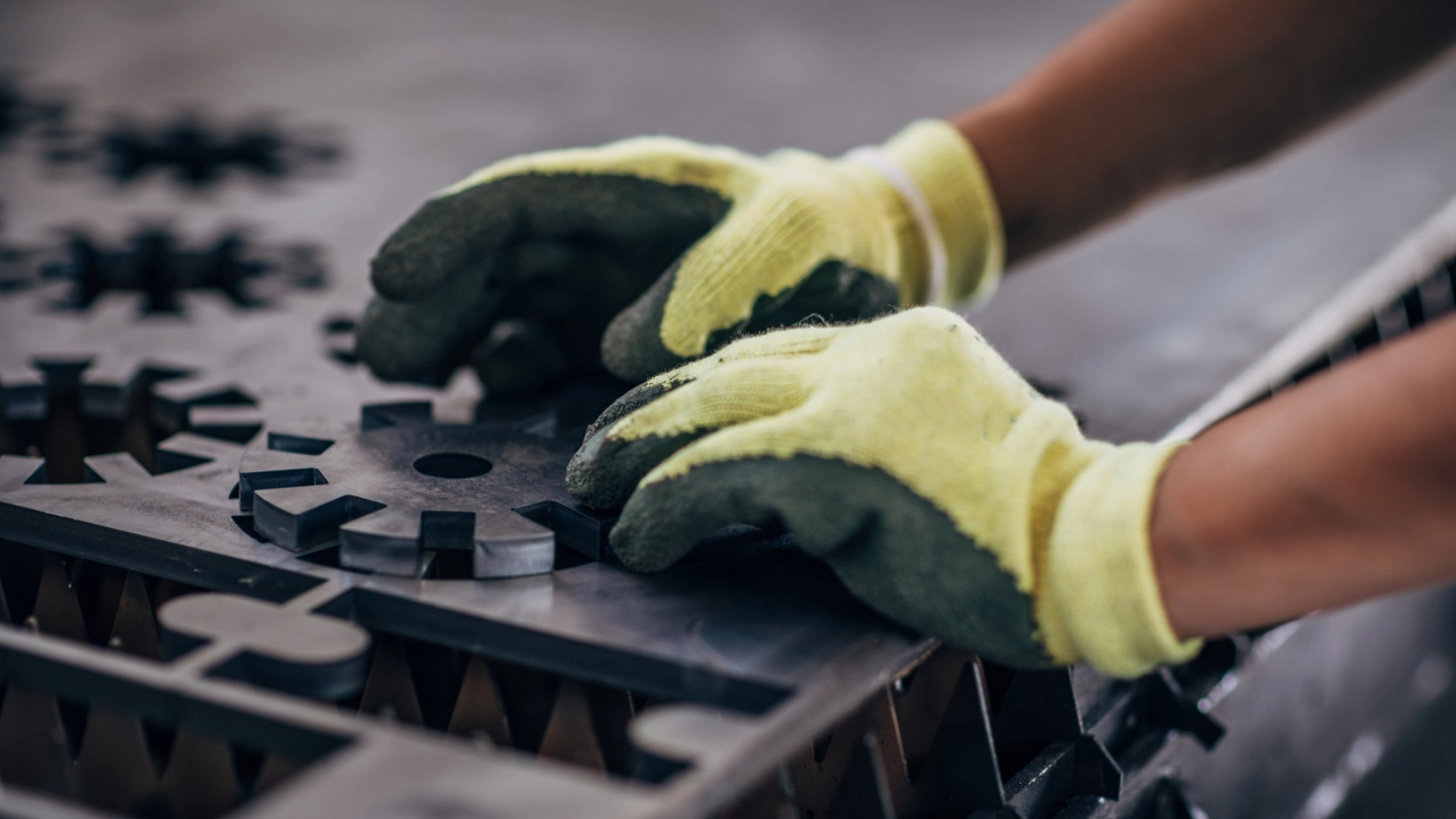 Close up of an engineer forming a metal component image